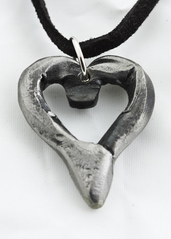 IMG_3729.jpg :: These iron hearts are hand-forged in very high heat, then shaped and molded into a unique form, and ultimately left with rough edges that define their character. Hmmm, made just like love!