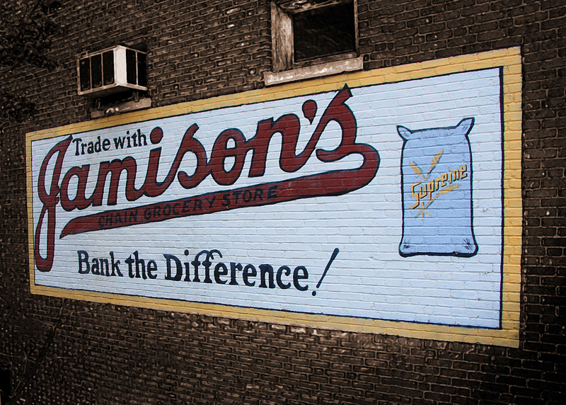Jamisons Sign-RTP.jpg :: The Jamison's sign was repainted several years ago. It's located on the building across the stream from the Masonic Theater. The shot was easy enough to take but required a lot of cleaning up because of the brush and weeds that had grown up in front of the sign.