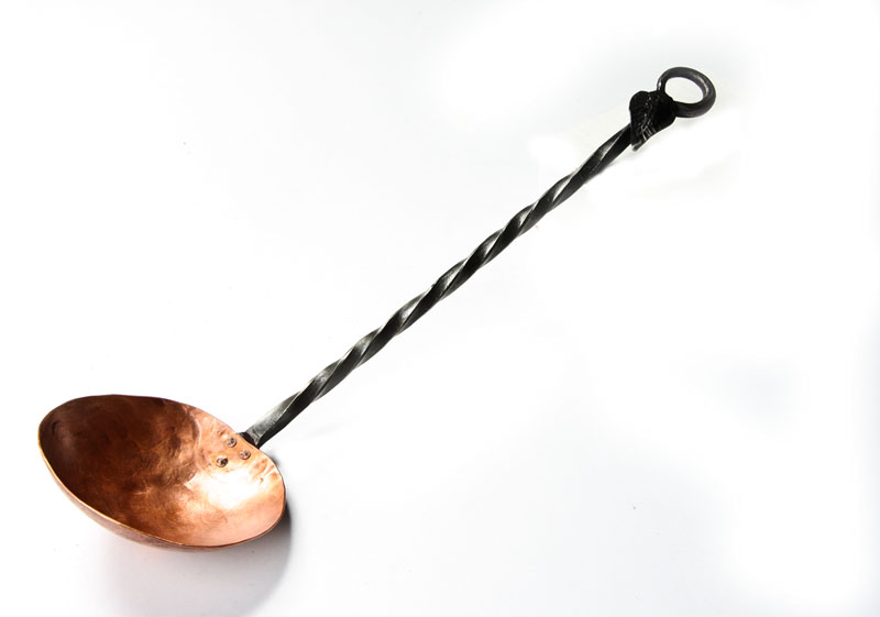 Ladle-Large Copper_005.jpg :: A long handled copper ladle. Thandle is approx 12 inches long and ends with a leaf and circle for hanging. The copper bowl is approx 3-4 inches across.