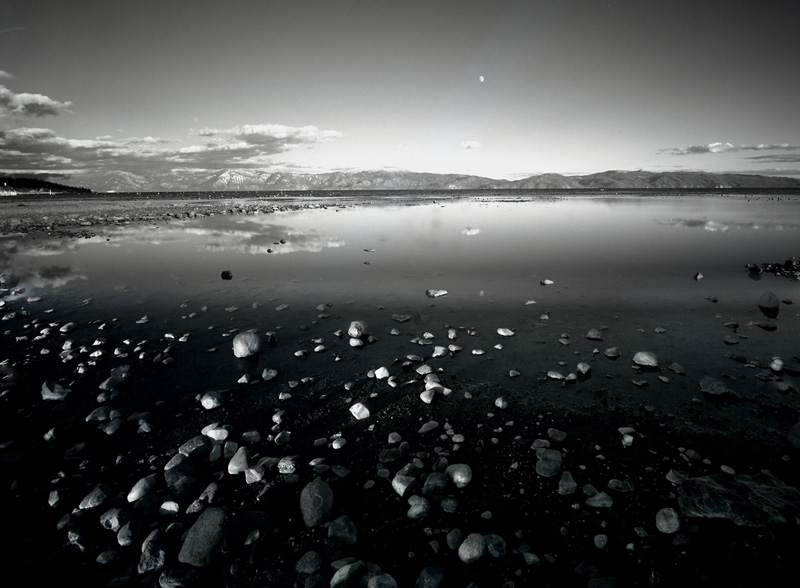 Lake Tahoe NV.jpg :: This is a shot of Lake Tahoe from the California side. The original image was shot with a 4x5 view camera on B&W film. The extreme depth of field comes from a small f/stop, careful focusing on a plane in the front 1/3 of the image area, and a tilt of the lens plane. Collectively, the technique is known as a \
