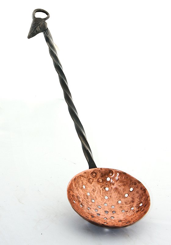 Spoon w-Copper Sieve.jpg :: $35.00 - This spoon is drawn and twisted out of square bar and a delicate leaf is added to a hanging loop at the end. The copper sieve is riveted to the shaft and lacquered to prevent discoloration. This looks great just hanging, that it's functional makes it even better.