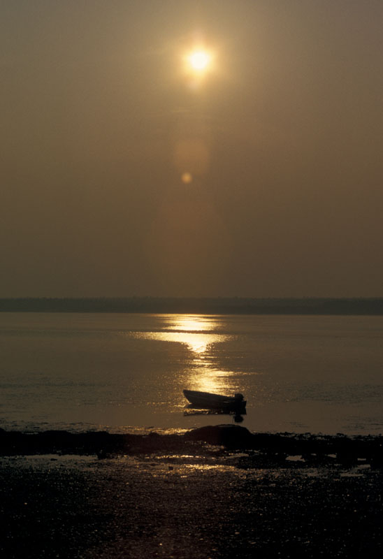 Sunset Boat.jpg :: Took this shot off the coast of the South China Sea whiuoe stationed in Okinawa. Originally shot on 35mm transparency film.