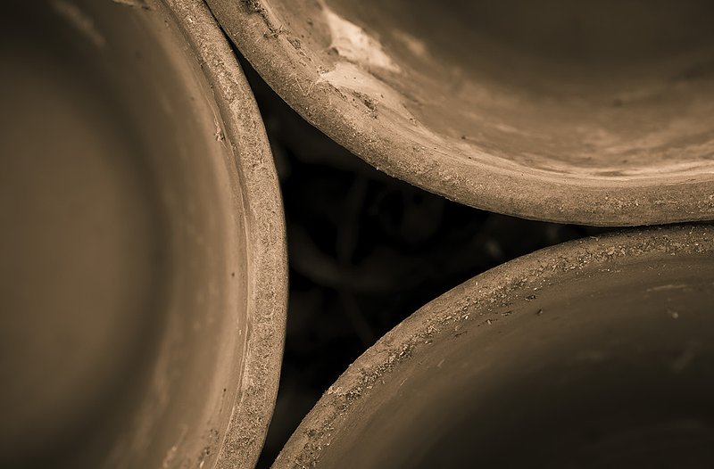Pots Abstract_0020.jpg :: Took these shots a few days before the still life workshop in Lexington as a warm up. The flower pots were stacked and forgotten near some equipment by the hay barn. I had to move and reposition them several times before I got a look that felt right. Used some warm tone in the final image.