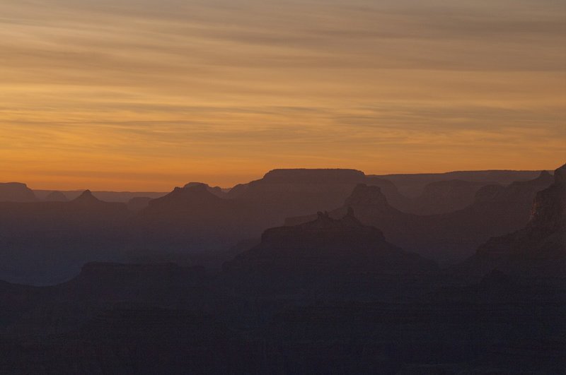 Mesa Silhouettes at Sunset Grand Canyon National Park 77237.jpg