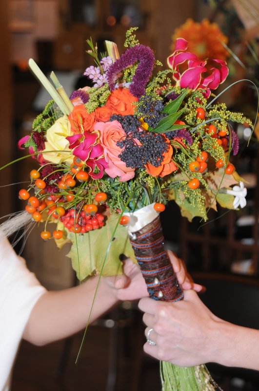 handing the bouquet.jpg :: I design and create one of a kind bouquets.
This one was for a Bride 