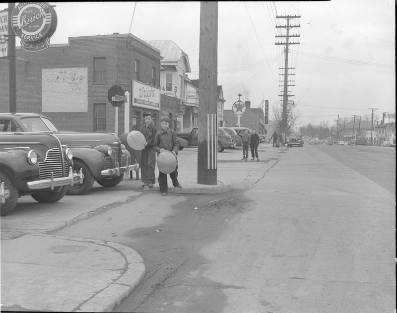 112A-B Boys with Balloons Wisconsin Ave facing south at Elm Street 1940.jpg :: BOYS WITH BALLOONS 7300 WISCONSIN AVE @ WILLOW, 1939