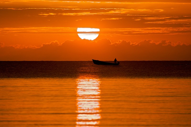 Sunset small boat 3534.jpg :: Negril Jamaica, small fishing boat with spectacular sunset