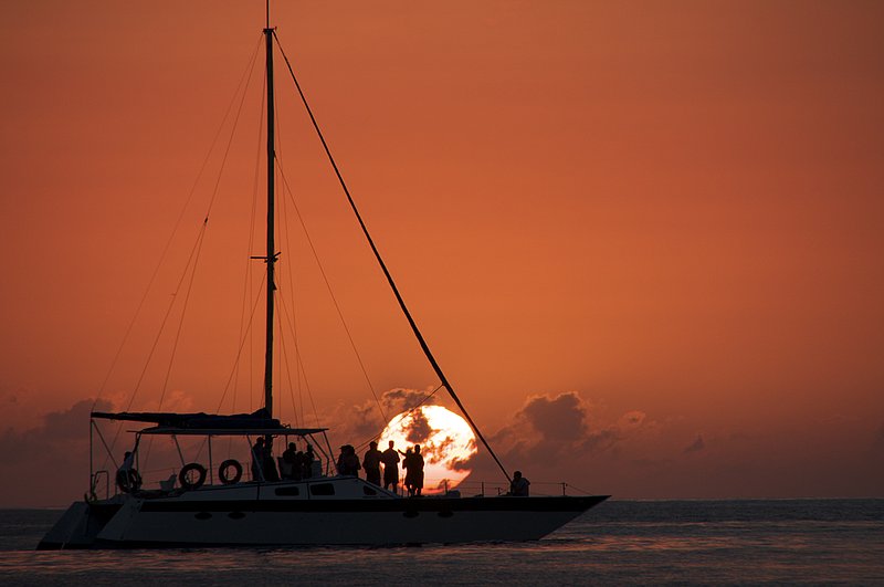 Sunset-with-sail-boat 75.jpg :: Negril Beach, Jamaica: Famous 7 mile beach of Jamaica. An evening sunset cruise boat being rewarded with a another great Jamaican sunset.