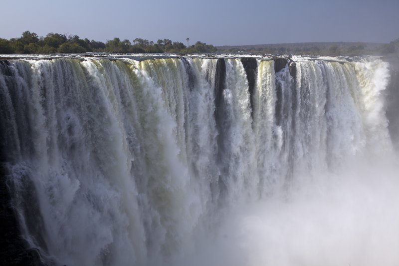 Victoria Falls from hike.jpg :: Victoria Falls: one of the main segments of the falls. This photo was taken from a vantage point across the gorge while on hike.