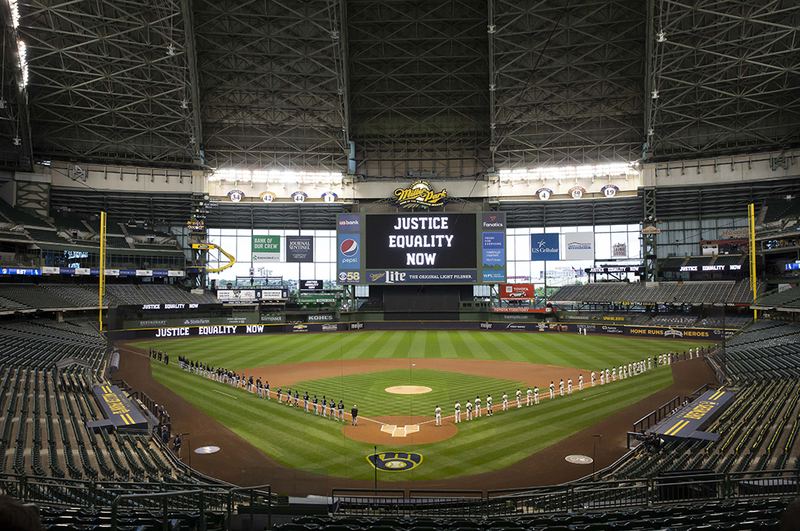 20200803_0052web(1).jpg :: August 3, 2020: Players line up for opening day introductions as the center field scoreboard displays \