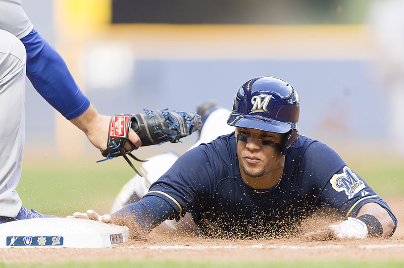 84 web(1).jpg :: May 31, 2014: Milwaukee Brewers center fielder Carlos Gomez #27 dives back to first base on a pick off attempt during the Major League Baseball game between the Milwaukee Brewers and the Chicago Cubs at Miller Park in Milwaukee, WI. Cubs lead the Brewers 2-0 in the 5th inning. John Fisher/CSM