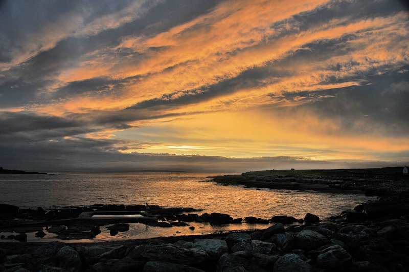 Doolin sunset west coast of Ireland.jpg :: Doolin is a coastal village in County Clare, Ireland, on the Atlantic coast. It borders the spa town of Lisdoonvarna. It is a noted centre of traditional Irish music, which is played nightly in its pubs like Gus O'Conners