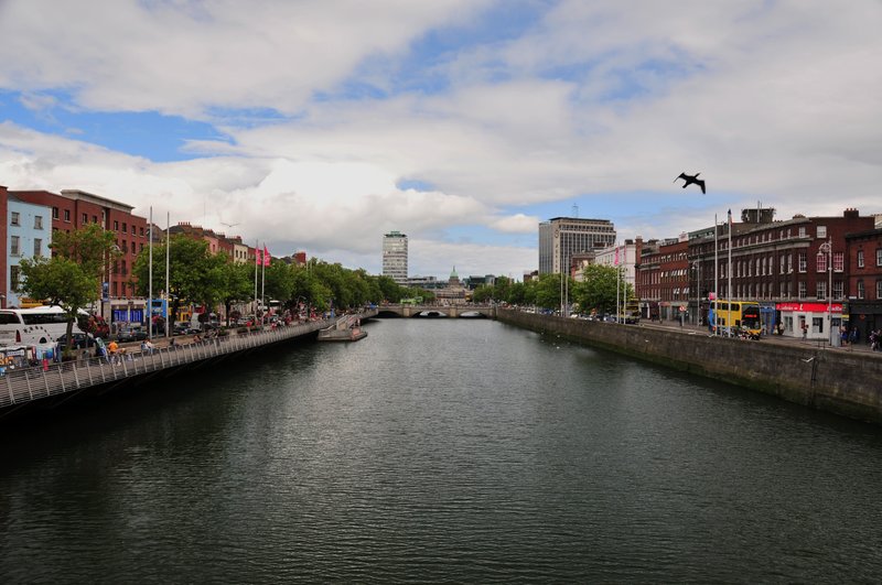 Dublins River Liffey.jpg :: The Liffey, meaning Life in Irish is a river in Ireland, which flows through the center of Dublin. All Dubliners have a love-hate relationship with the River Liffey. Irishmen believe that watching the sun set over the Ha'penny Bridge could bring a tear to the eye. This  photo was taken from Ha' penny bridge.