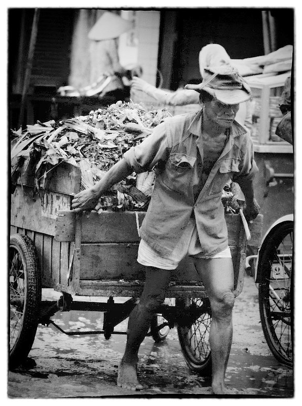 Barefoot Toil.jpg :: It's a daily effort, year after year with little to look forward to except hands that are callused, bare feet that are cracked and caked with the mud from the Monsoons.  