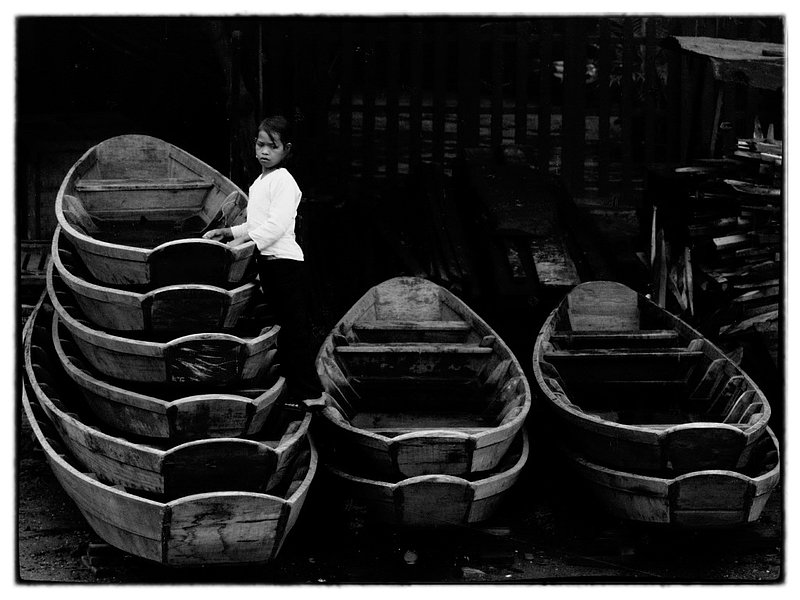 Boat Girl.jpg :: In Vietnam everyone regardless of age contributes to their livelihood and that of their family this young girl manages  boat rentals.