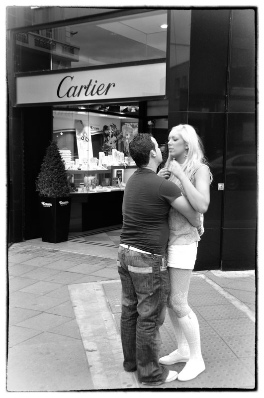 Dublin Street romance.jpg :: Affection was not restrained on the streets of Dublin, holding hands, hugging, enbraceing seem to be tolerated by the society. Im not sure if this couple had thoughts of  entering Cartier.
