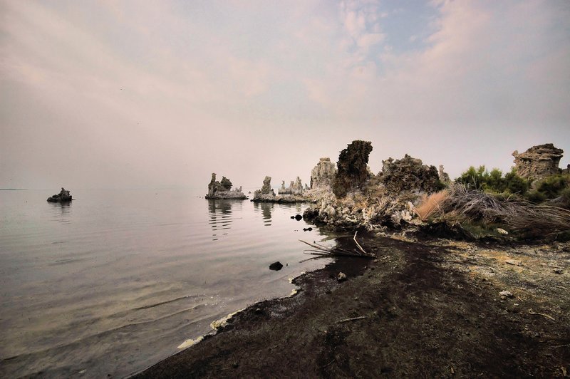 Encroachment.jpg :: As the haze creeps in from the west blocking the blue sky, the scenes at Mono constantly change. At first I was somewhat disappointed in the timing of my visit, I suddenly realized that I was probably the only photographer on scene that day and this was a gifted opportunity to capture a different and enchanting experience with my cameras, documenting a possible once in a life time event.