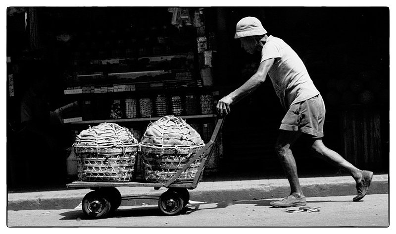 Faceless.jpg :: The streets are filled with scenes like this, people busy discharging their daily work, they are faceless in most cases, struggling every day of their lives.