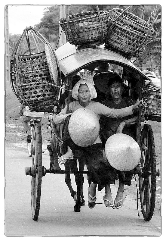 Hats and Baskets.jpg :: Women transporting empty baskets in a rickshaw like buggy
