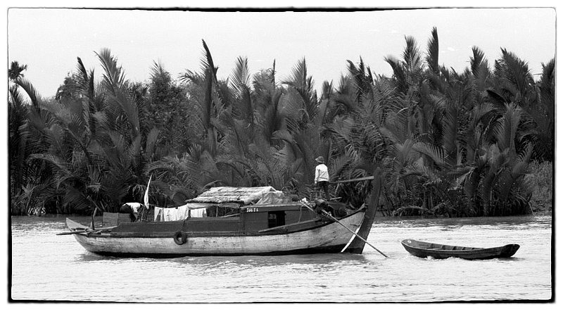 Nine Dragons.jpg :: Life in the Mekong Delta revolves much around the river, villages are accessible by rivers and canals rather than by road. The word Mekong translates in Vietnamese to mean Nine Dragons, recognizing that there're nine tributaries that feed the River. American River Patrol boats often find themselves under fire especially at night.