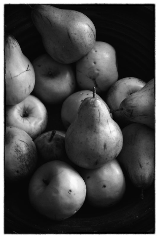 Pears.jpg :: Again form, depth and texture takes precedence in creating a still life of  pears stacked in an open air market. using only the light available.. It is important that a photographer  visualize in the medium that will best make his visual statement. For me this scene cried out for  black and white  for this still life capture.