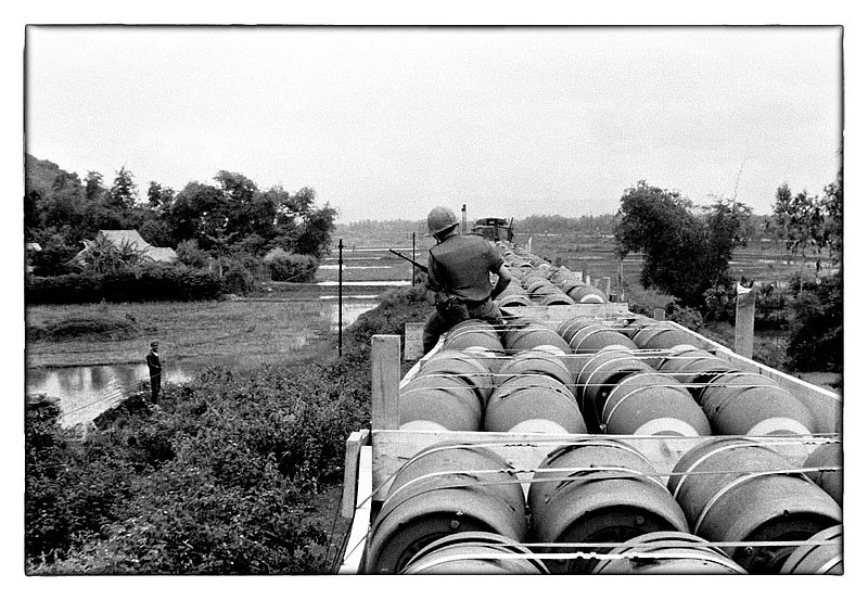 Phu Cat and Back.jpg :: Transporting 2000lb bombs North from Saigon by rail along the coast of Vietnam and the South China Sea. This railroad line iwas running to Phu Cat it is a principle rail line.
