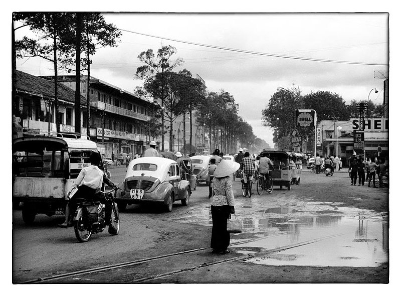 Street chaos.jpg :: The streets in and around Saigon are frantic twenty four hours a day. Afternoon Monsoon's cause traffic to deviate around puddles of water and even use sidewalks to reach their destinations. The mixture of smoke, fuel, cooking, and brutal hot weather make it unpleasant for all who travel. Surprisingly accidents are few and mostly minor in nature.