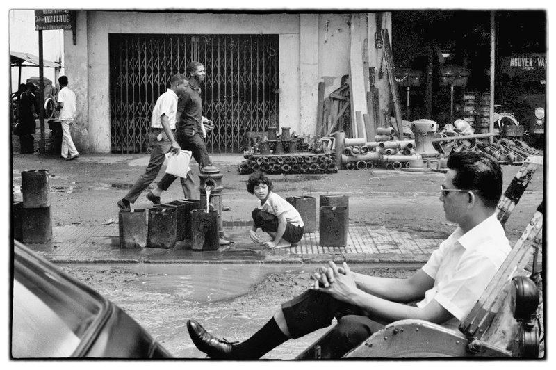 The Photographer.jpg :: Every so often throughout Vietnam, i would hire a rickshaw to wander in search of a photo opportunities. Somehow i needed to photograph the human condition especially in the time of war.