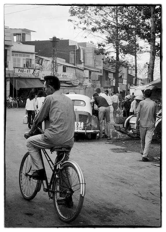 Transportation.jpg :: Bicycling is extremely popular as a mode of transportation for younger people even though they are not protected from the daily Monsoons. I believe its a state of mind that is different than ours, one that they have accepted as being normal.
