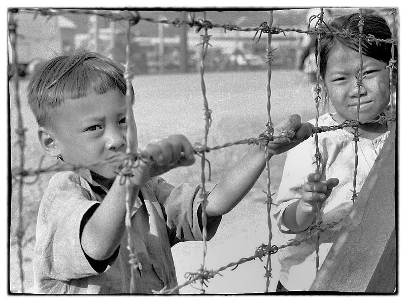 Viet Children.jpg :: Young Vietnamese children hanging out near the Long Bien Army Base. They appear daily and hang around for food or other items given or found.