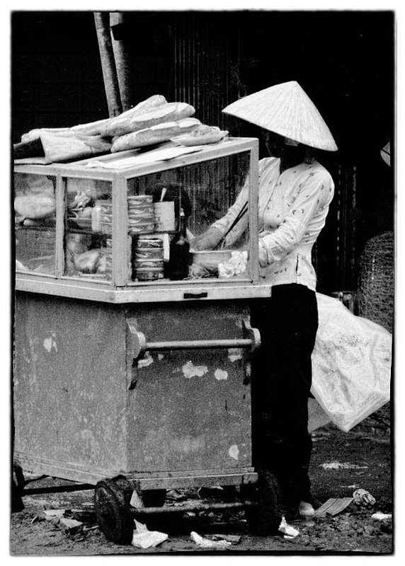 Vietnamese Street Carts.jpg :: Scattered throughout Vietnam are what the American GI's called Howard Johnson's serving Vietnamese street food. The Vietnamese people love to eat and are constantly cooking. The cuisine is so varied on could spend a lifetime eating without repeating.