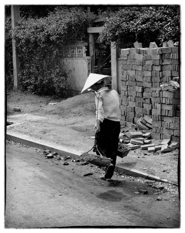 Walking.jpg :: Walking is prominent in Vietnam, most of the people cannot afford motorized transportation and rely on a neighbor or friend who may have a motorized vechle for longer travel needs.