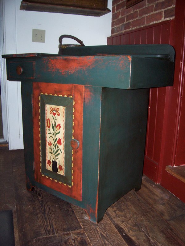 100_1729.jpg :: Charming reproduction small size dry sink. Hand painted and hand aged with tulip pannel door.$495.00
