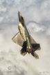F-22 Raptor in Clouds vertical.jpg