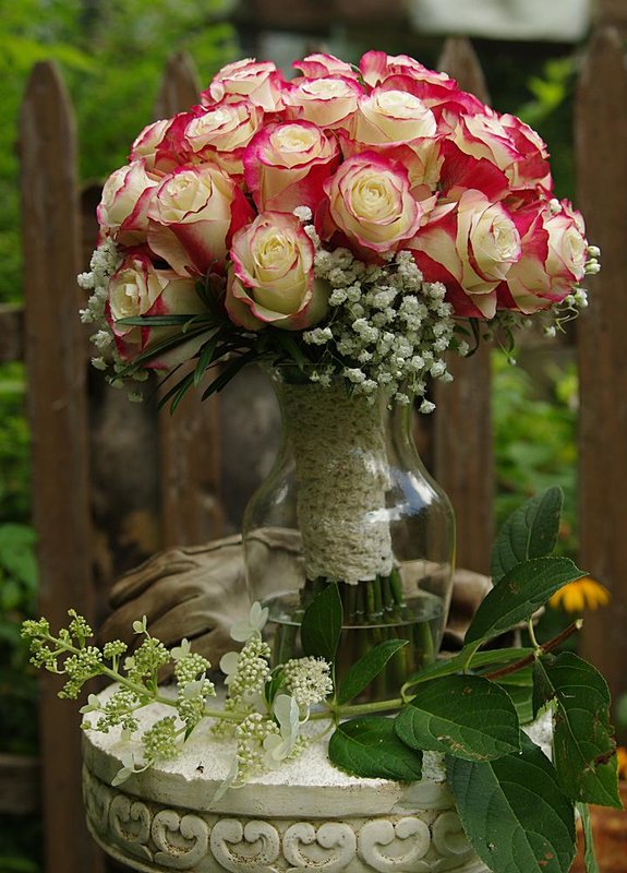 August 4 bridal bouquet with grandmothers dress wrap.jpg
