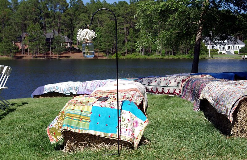 Hay bales covered with quilts for seating.jpg