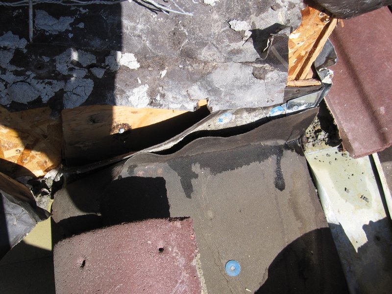 IMG_0247.jpg :: Chimney-roof flashing leak.