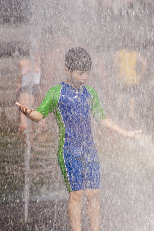 Washington Square Park.jpg :: Boy taking advantage of the sprinklers on a hot day