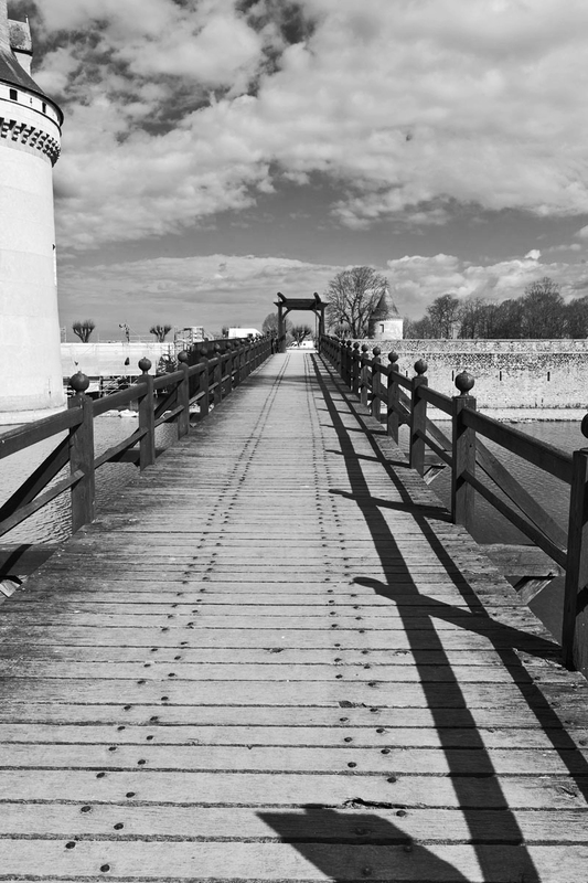 FRA_9745bw(1).jpg :: Wooden Drawbridge access to Château de Sully in the Loire Valley, France