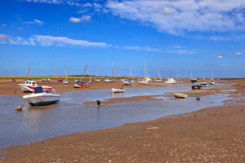 NFK20_055.jpg :: Boats stranded on the Creek at low tide at Brancaster Staithe, Norfolk, UK