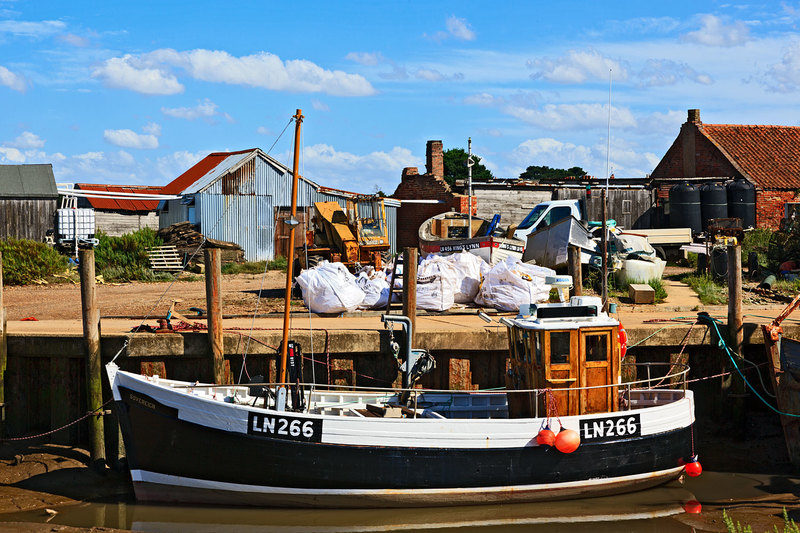 NFK20_065.jpg :: Fishing Boat moored in the harbour at low tide at Brancaster Staithe, Norfolk, UK