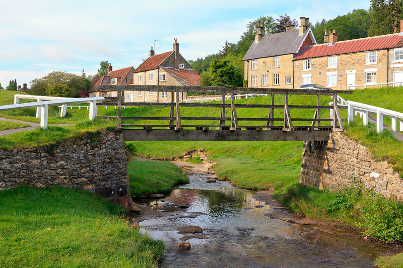 NYM19_015.jpg :: Wooden Bridge over Hutton Beck in the Village of Hutton-le-Hole on the edge of the North York Moors in Yorkshire, England, UK