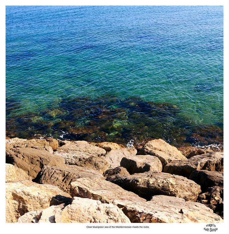 SPN19_0661(1).jpg :: Clear water of the Mediterranean lapping on the rocks at the base of the seawall to Port of Dénia on the Costa Blanca, Spain
