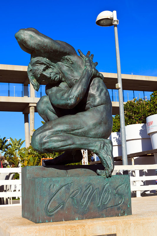 SPN19_463.jpg :: Modern statue of a Naked Man in defensive pose by Cronos located in El Portet Marina in Dénia, Costa Blanca, Spain