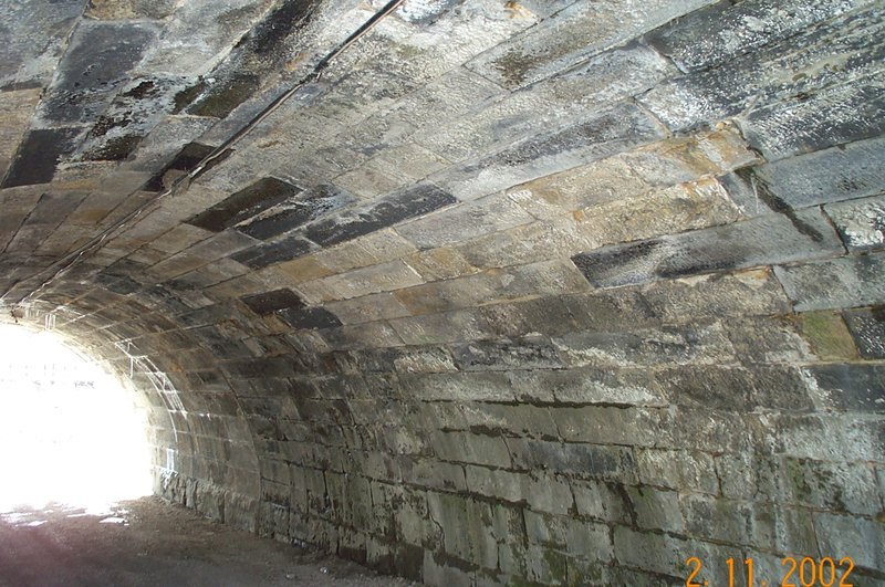 A-large-arched-stone-underpass-inside.jpg