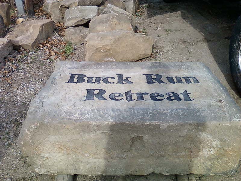 Reclaimed Bridgestone Sign with Buck Run Retreat etched into a crandle faced foundation stone.jpg :: Reclaimed Bridgestone Sign with Buck Run Retreat etched into a crandle faced salvaged foundation stone