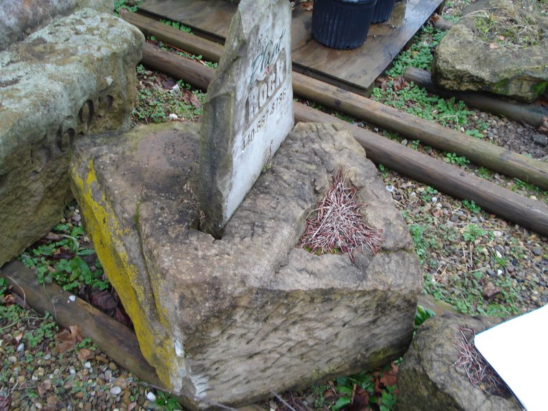 Reclaimed Bridgestone Sign with Plant-a-Rock etched into a slab in a planter pedestal.jpg :: Reclaimed Bridgestone Sign with Plant-a-Rock etched into slab into a planter pedestal