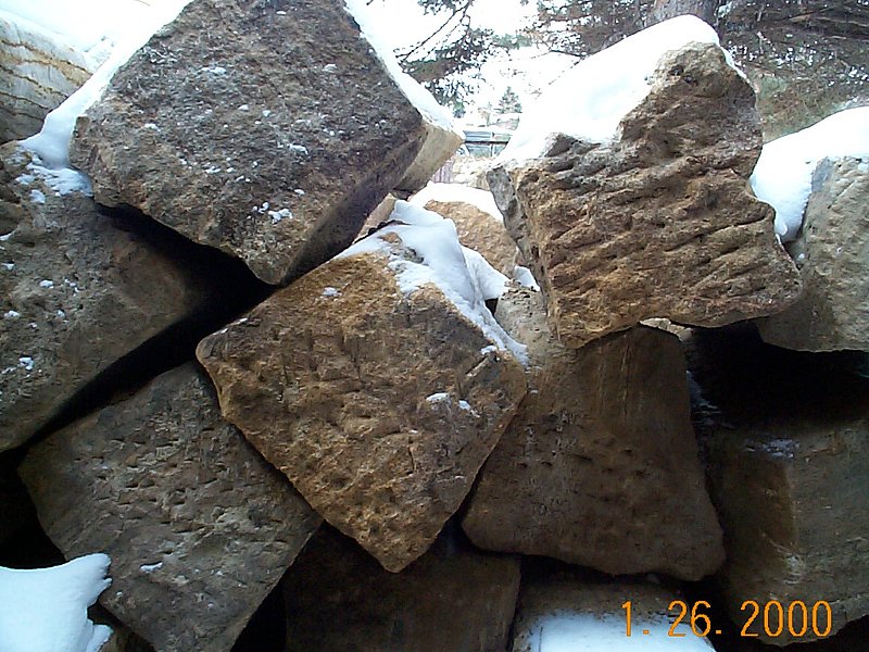 Reclaimed sandstone Archstones salvaged from a stone culvert.jpg :: A selection of reclaimed sandstone archstones from a salvaged stone culvert
