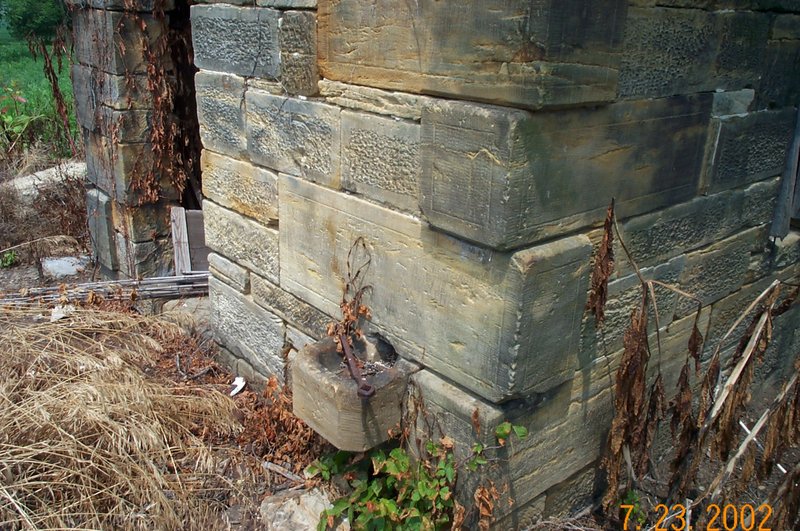 Stone-springhouse-NW-water-outlet.jpg
