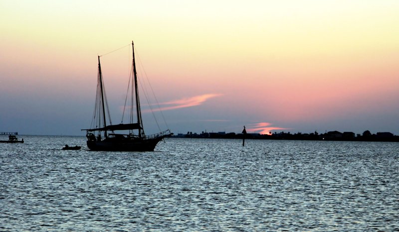 Boat and Dingy in the sunset.jpg :: Galveston Texas